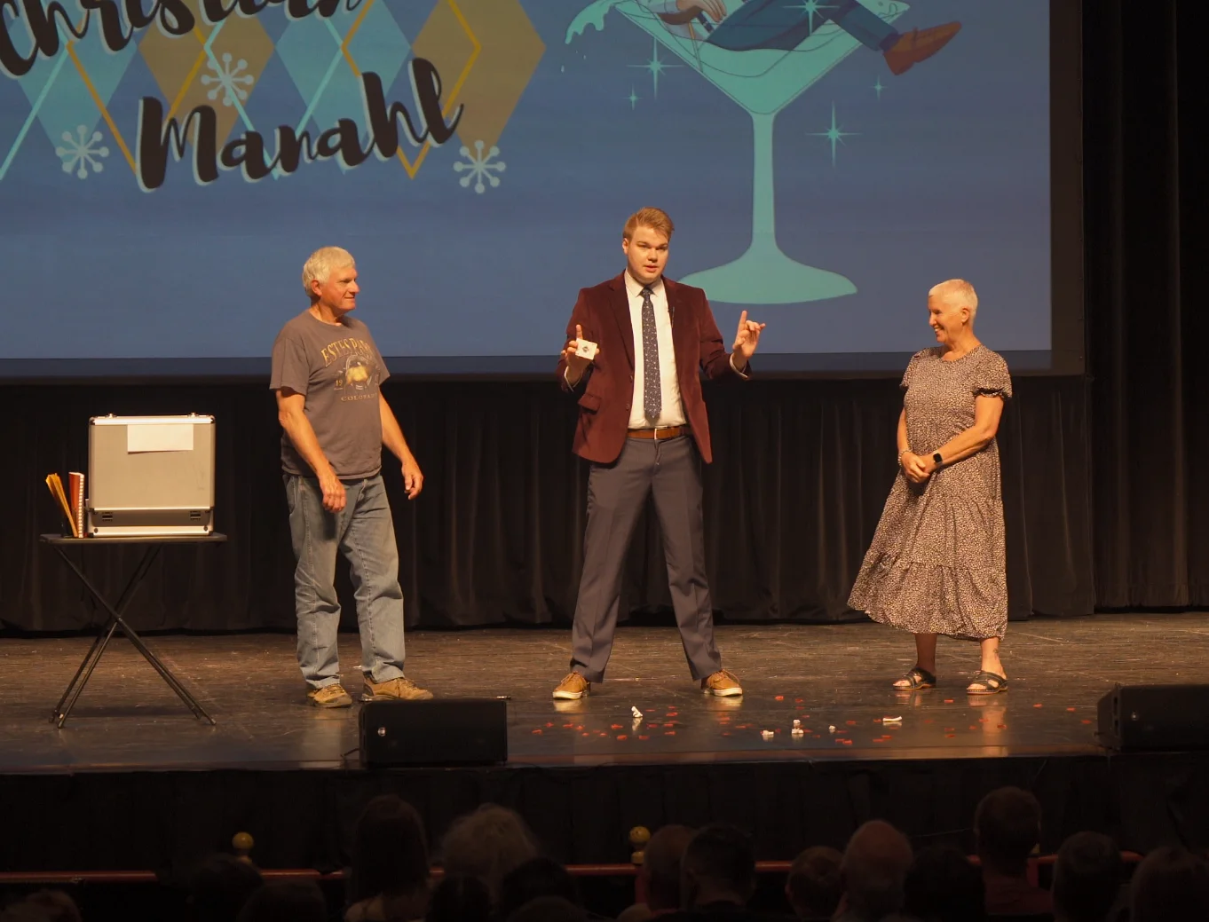 Chris Marvell performing a stage show with two audience volunteers